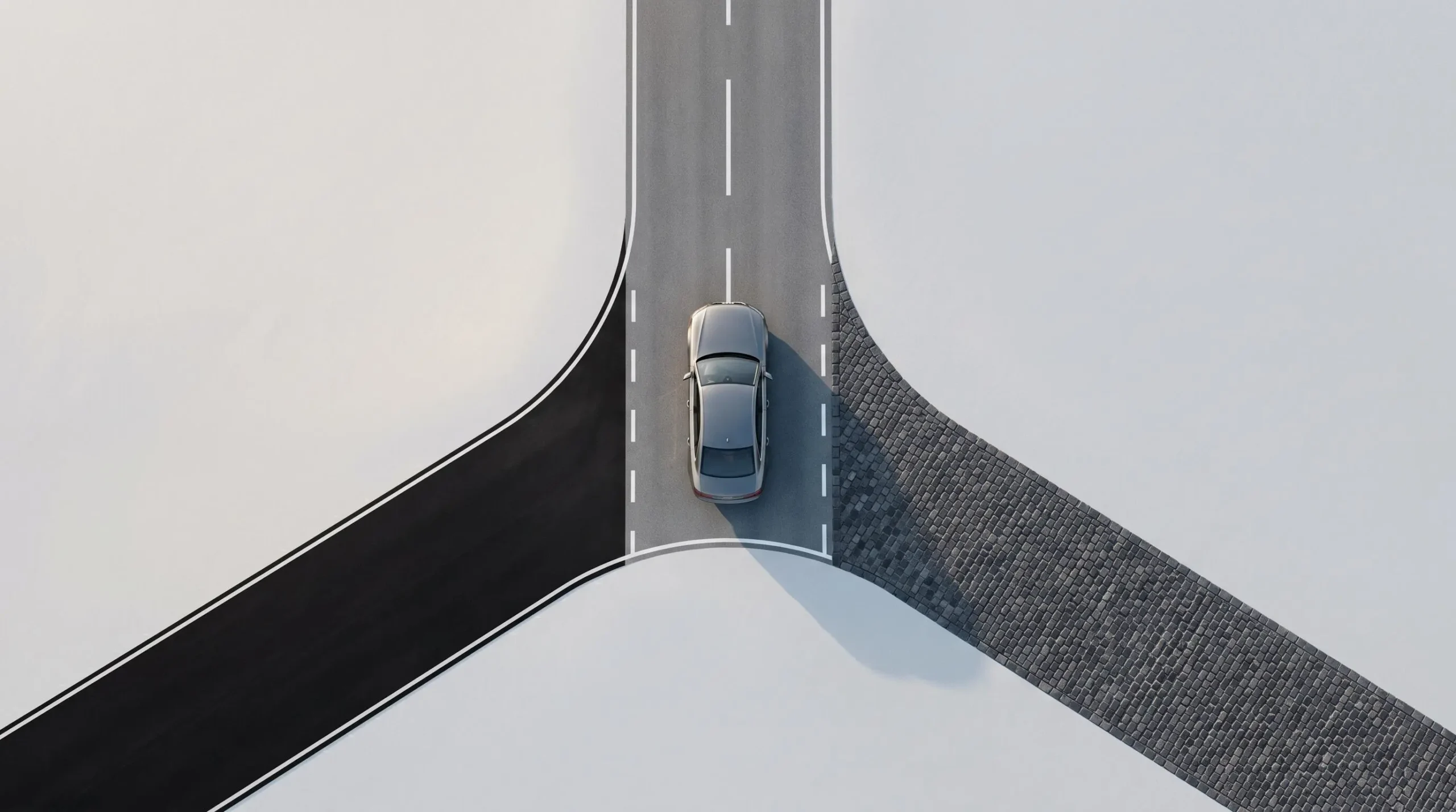 Vue aérienne d'une voiture moderne positionnée à un carrefour face à trois routes différentes, symbolisant le choix entre solutions de financement automobile